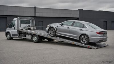 Погрузка битого автомобиля на эвакуатор